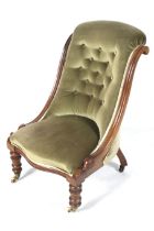 A Victorian walnut slipper nursing chair.