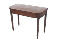Early 19th Century mahogany dark inlaid fold over top card table.