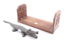 A hardwood book slide and novelty nut cracker.