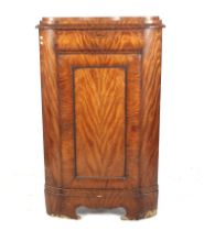 A 19th century Dutch floor standing corner cabinet.