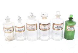 An assortment of Apothecary, Chemist, Pharmacy bottles all with applied gilt labels ,