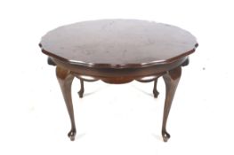20th century mahogany circular shaped four leg coffee table.