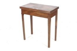 A 19th century mahogany fold over card table, 72cm H, 65cm W, 35 D, with green based lining,