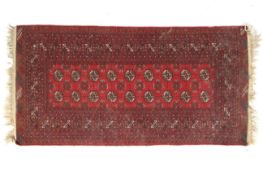 A red Persian style wool rug.