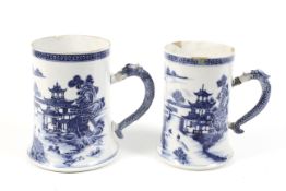 A near pair of 18th century Chinese blue and white export tankards.