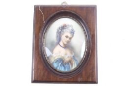 A 20th century ivorine portrait miniature of a lady. Framed and glazed.