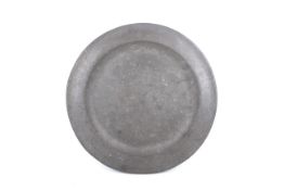 An early 18th century pewter single-reed charger.