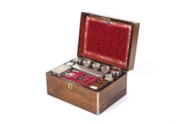 A Victorian mahogany and brass-bound travelling vanity box.