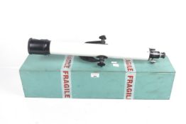 A boxed Tasco refractor telescope. Model 5VTE 60mm x 60mm. With two lens caps.