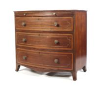 A Regency Sheratoh mahogany bowfront chest of drawers.