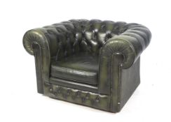 A 20th century chesterfield style armchair.
