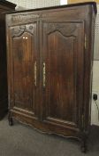 A 19th century French oak two door wardrobe with carved detail, 168cm H, 122cm W,