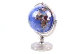 A 20th century hardstone and semi-precious set terrestrial globe. On a gilt metal gimbal stand.
