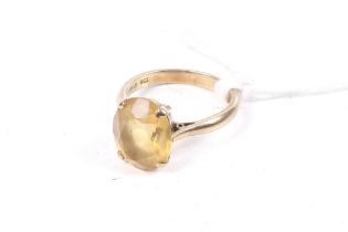 A vintage oval citrine single stone ring.