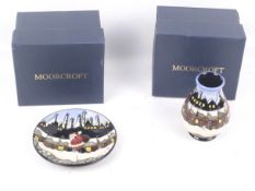 Two Moorcroft matching Christmas related items.