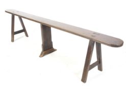 A rustic early 20th century jointed wooden 'slaughter' bench.