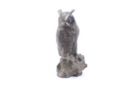 A cast bronzed figure of a long eared owl.