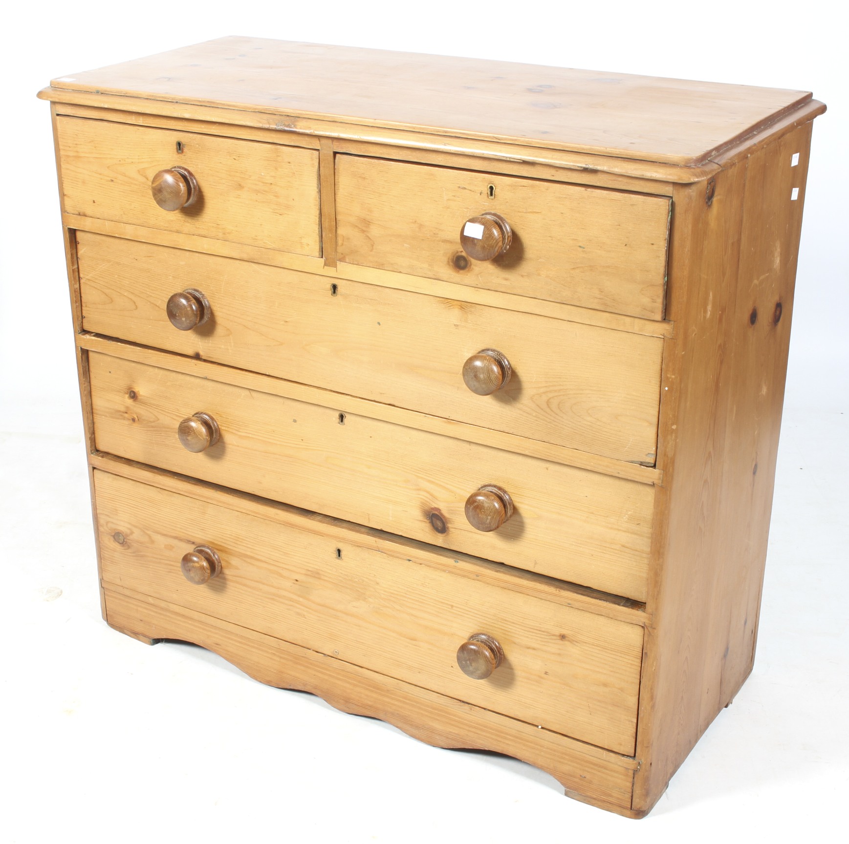 A 20th century pine chest of drawers.