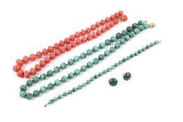 A malachite necklace, bracelet and earring set and a coral necklace.