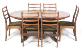 Circa 1970s G-Plan Fresco oval extending dining table and six chairs.