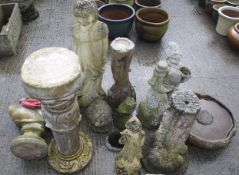 A collection of assorted reconstituted stone garden ornaments.