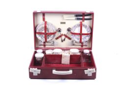 A vintage Brexton china picnic set. Including gilt china cups and saucers (#7333) for four, etc.