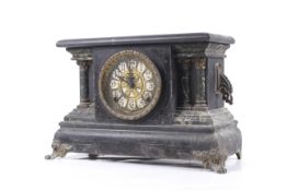 A Victorian black marble effect wooden cased mantel clock.