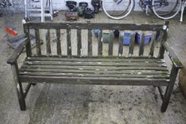 A traditional wooden garden park bench.