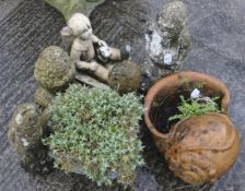 Eight reconstituted stone and terracotta garden figures and pots.