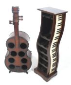 Two wooden wine display racks in the shape of musical instruments.