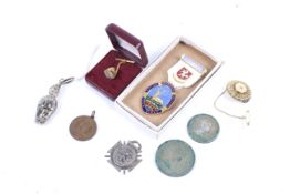 An assortment of silver, coins and costume jewellery.