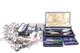 A collection of silver plated cutlery, flatware and serving items.