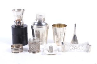 A group of silver and white metal collectables.