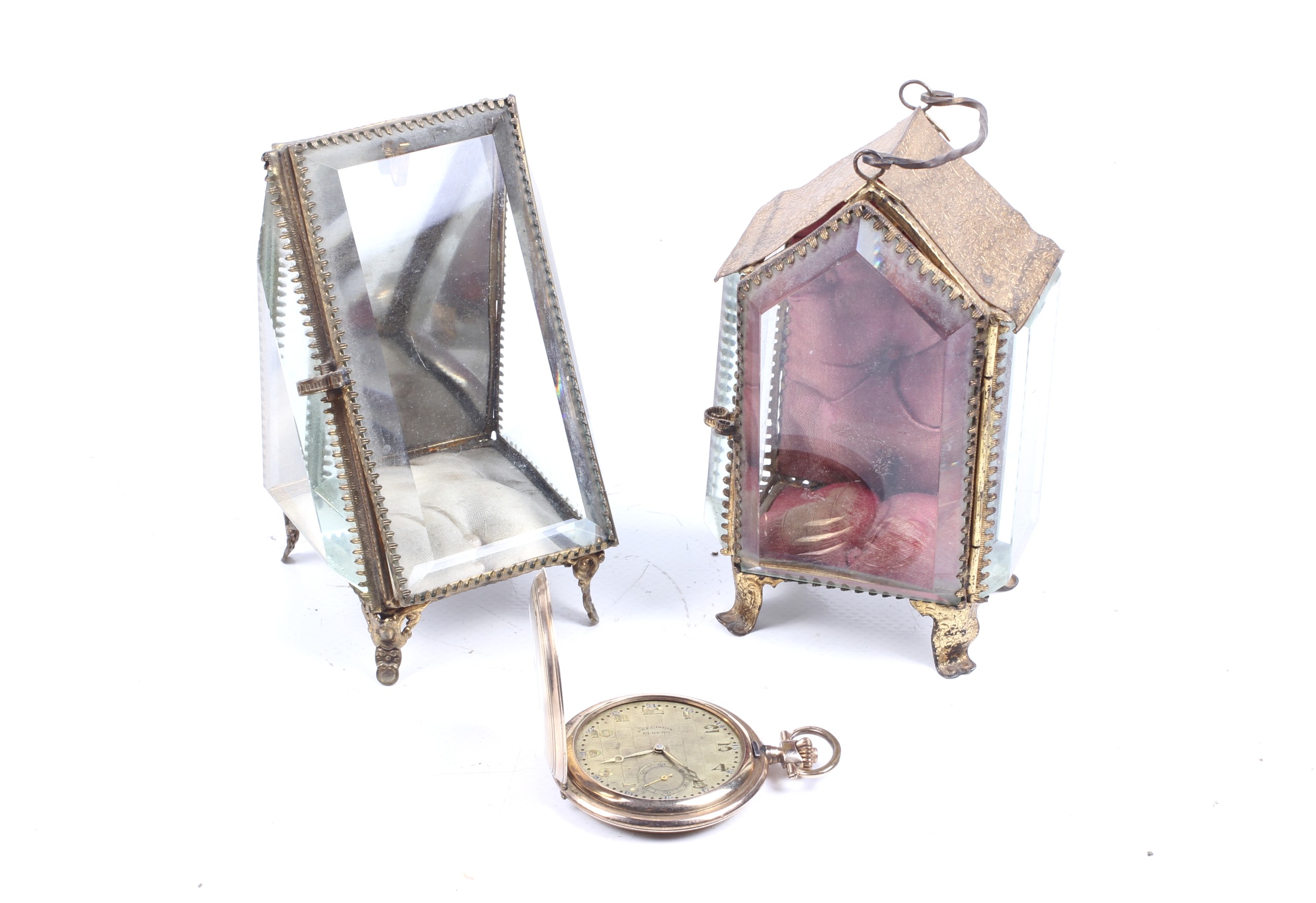 Two pocket watch stands and a gilt metal hunter-cased keyless pocket watch.
