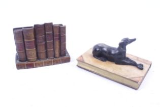 Two book related ornaments. Comprising a spelter model of greyhound lying on a book, L15.
