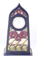 A Moorcroft mantel clock.