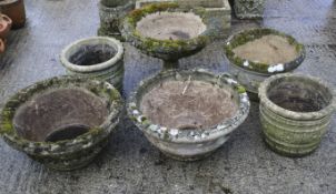 A group of six assorted reconstituted stone garden planters.