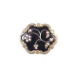 A Victorian gold, black enamel and half pearl shaped oval mourning brooch.