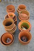 A collection of assorted terracotta garden flower pots. Max.