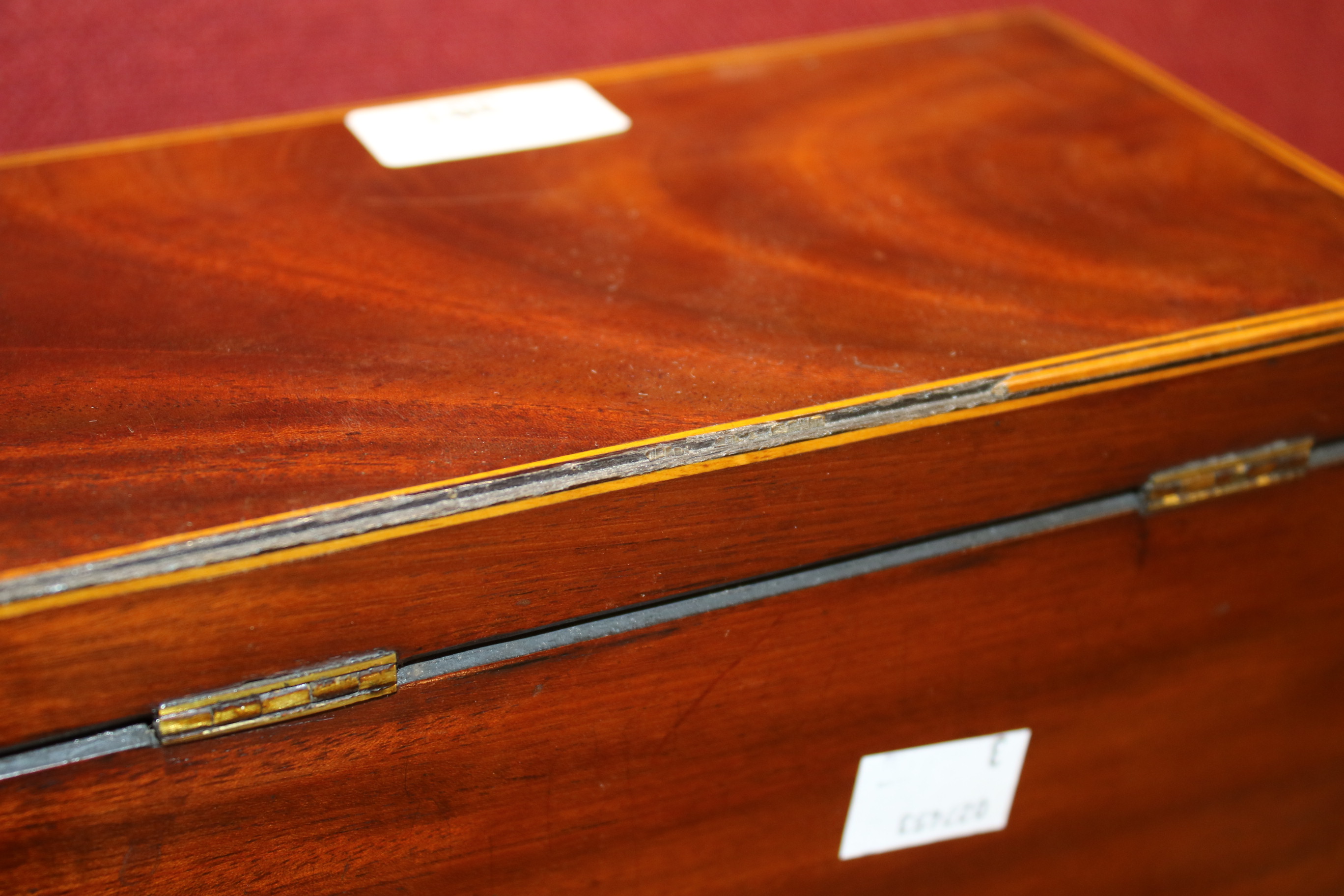 A 19th century mahogany veneered tea caddy. - Image 7 of 10
