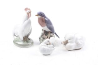 Four Royal Copenhagen porcelain figures of birds.