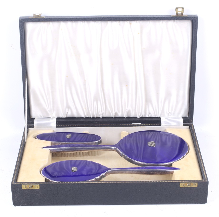 A vintage boxed blue enamel Royal Navy dressing set.