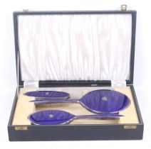 A vintage boxed blue enamel Royal Navy dressing set.