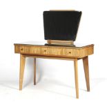 A Cumbrae Furniture by Morris of Glasgow dressing table and a stool.