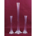 Three Victorian style glass lily vases. A pair and one other. Max.