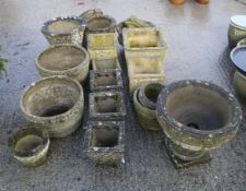 Seventeen reconstituted stone garden pots, urns and ornaments.