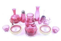 A collection of Victorian and later cranberry glassware.