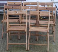 A set of eight folding garden chairs.