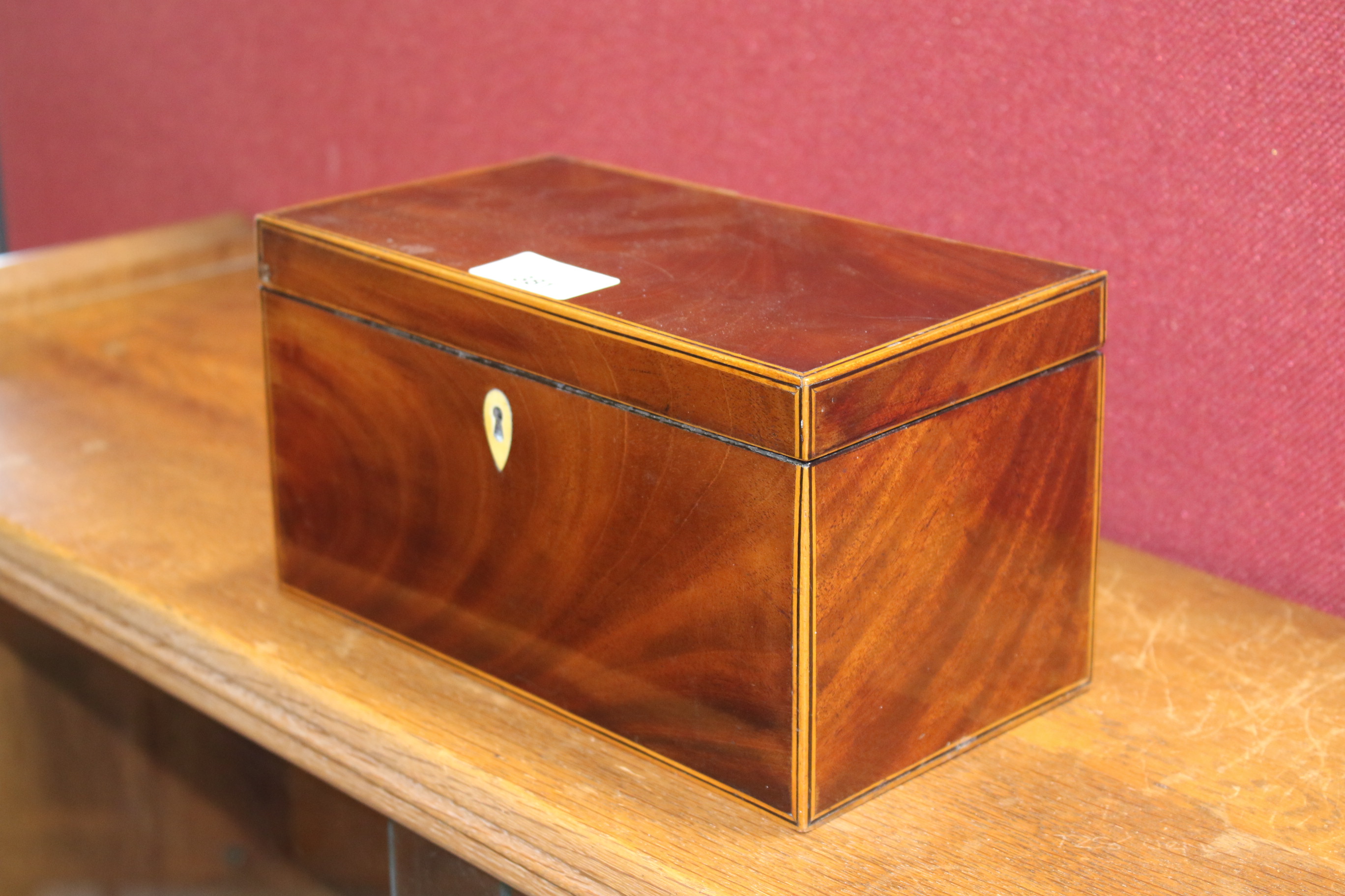 A 19th century mahogany veneered tea caddy. - Image 3 of 10