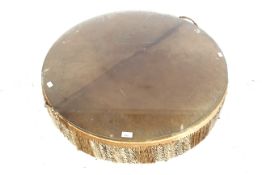 African animal hide tribal drum coffee table.